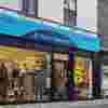 Kingston Upon Thames Fight for Sight Charity Shop, a turquoise exterior with our navy logo and the words Save Sight. Change Lives.