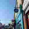 West Norwood Fight for Sight Charity Shop, a turquoise exterior with our navy logo and the words Save Sight. Change Lives.
