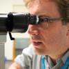 Professor Pearse Keane using an eye scanner
