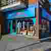 Tulse Hill Fight for Sight Charity Shop, a turquoise exterior with our navy logo and the words Save Sight. Change Lives.