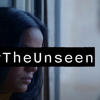 A person looking down with a sombre background, with the words '#The Unseen' covering her eyes